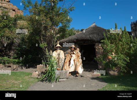 Two Men Outside Traditional Hut At Basotho Cultural Villageqwa Qwa