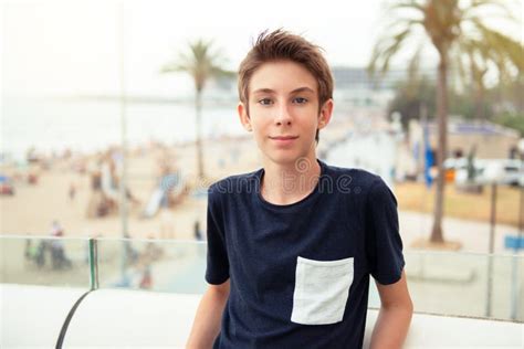 Handsome Young Boy Looking At Camera Over Panorama Of Alicante