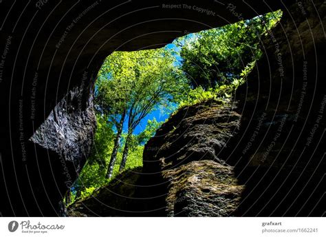 Rocky Cave With Trees A Royalty Free Stock Photo From Photocase