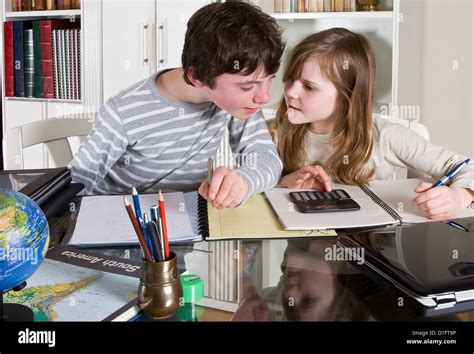 Children Helping Each Other Study Hi Res Stock Photography And Images