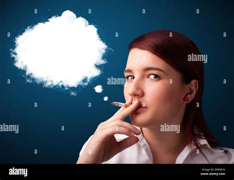 Young Woman Smoking Unhealthy Cigarette With Dense Smoke Stock Photo