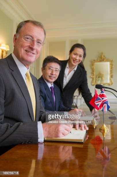 Group Of Old Men In Suits In A Boardroom Photos And Premium High Res