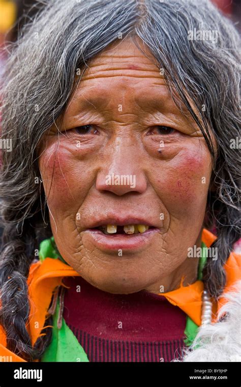 Tibetan Old Woman Pilgrim With Grey Hair In The Barkhor Lhasa Tibet