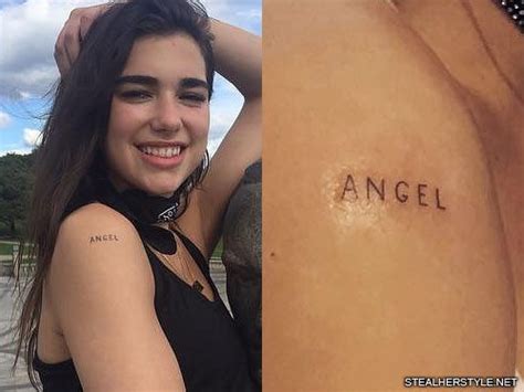 These are all of the tattoos that dua lipa currently has: Dua Lipa Writing Shoulder Tattoo | Steal Her Style