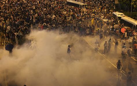 Police Fire Tear Gas And Baton Charge Thousands Of Occupy Central