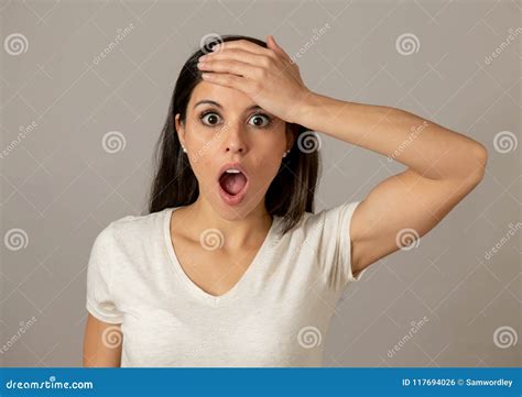 Young Attractive Woman With A Surprised And Shocked Face Eyes And