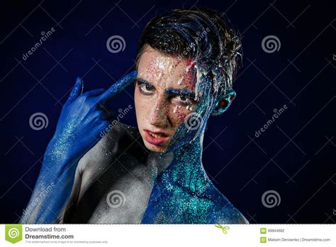Crazy Young Androgyne Man With Face Art Freak Person Stock Photo