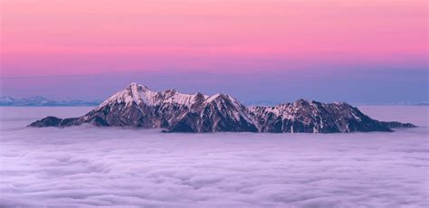Snow Covered Rocky Mountain Above Clouds Free Image Peakpx