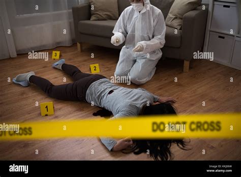 Criminalist Collecting Evidence At Crime Scene Stock Photo Alamy