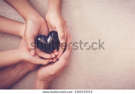 Hands Holding Black Heart Health Insurance Stock Photo Edit Now