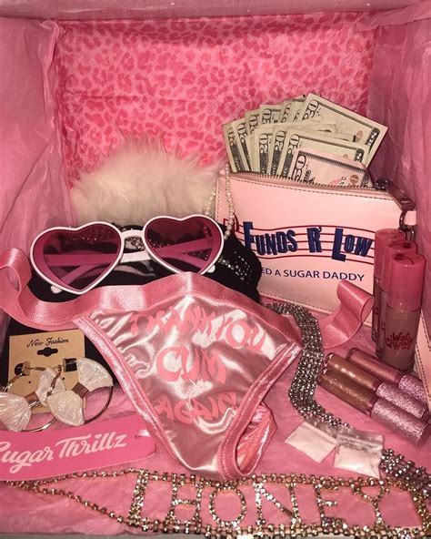 A Pink Purse Filled With Lots Of Items Like Lipstick Sunglasses And