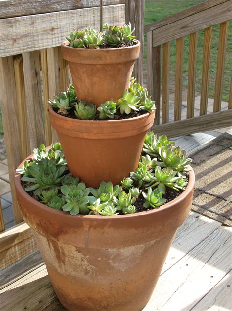 Stacked Terracotta Pots Filled With Hensnchicks Easy To Do And Looks