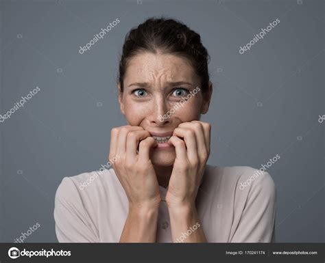 Terrified Young Woman Stock Photo By ©stokkete 170241174