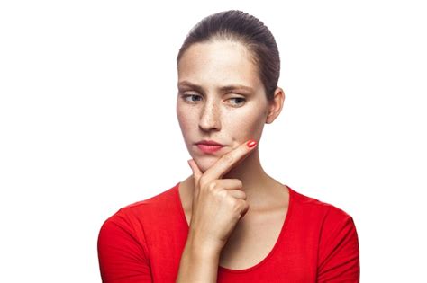 Premium Photo Portrait Of Thoughtful Serious Woman In Red Tshirt With