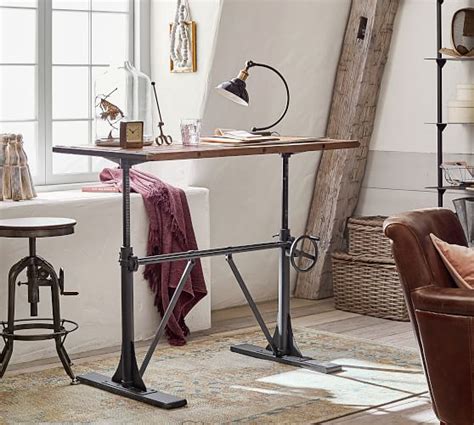 Standing desks are designed for writing, reading or working while standing up or sitting on a high stool. Pittsburgh Crank Standing Desk | Pottery Barn
