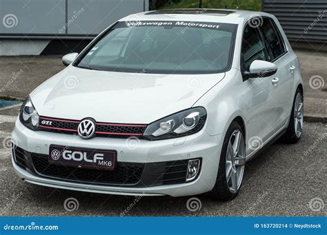 Front View Of White Volkswagen Golf Gti Mk6 Parked In The Street