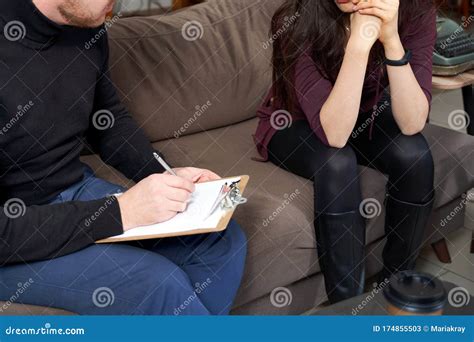 cropped female patient talking to her therapist who is making notes stock image image of note