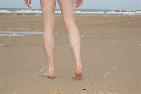 Nude Legs Of A Man Naturist On Beach Stock Photo By Oceanprod