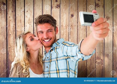 Composite Image Of Attractive Couple Taking A Selfie Together Stock Image Image Of Fence