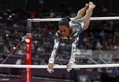 Us Gymnast Gabrielle Douglas Performs During The Womens Uneven Bars