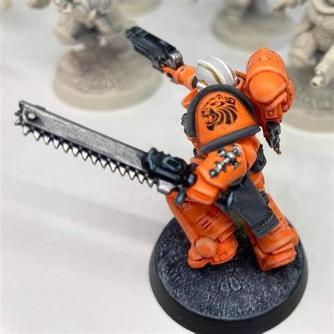 Orange And Black Warhammer With Chainsaw