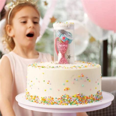 this surprise cake stand pops a secret t out of the center of the cake surprise cake cake