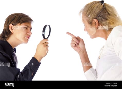 Teenage Boy Indifferent To His Mothers Scolding Inspecting Her Finger