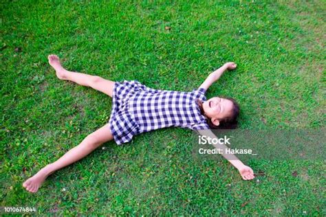 Girl Lie Down On The Lawn Stock Photo Download Image Now Lying Down