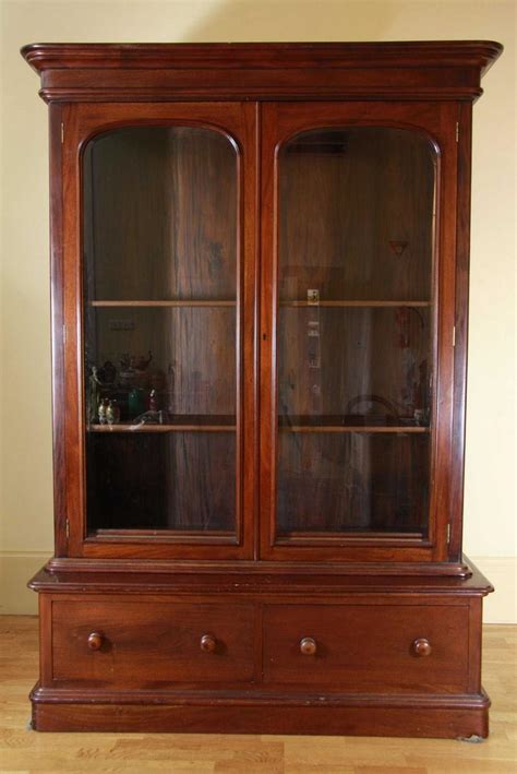 Choose from different styles to suit your room. A mahogany two door bookcase, circa contemporary, the ...