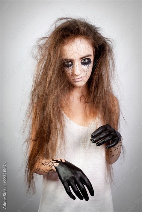 Crazy Girl With Disheveled Hair Black Eyes And Veins Concept Of