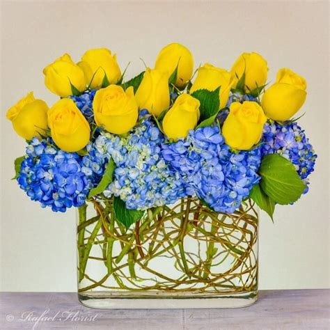 Contemporary Floral Design Of Blue Hydrangeas And Yellow Roses In A