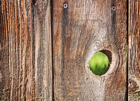 Hole In A Wooden Fence Stock Photo By ©graphicphoto 61015703