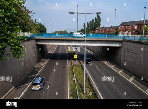 Urban Motorway Showing Bridge Over The Motorway With A Vehicle