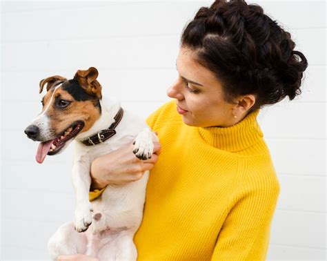 Free Photo Portrait Of Woman Holding Her Dog
