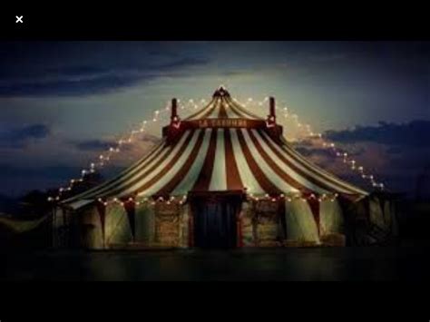 A Large Circus Tent With Lights On It