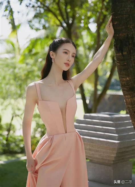 jin chen is wearing a long soft pink dress which makes the fair skinned fairy rejoice inews