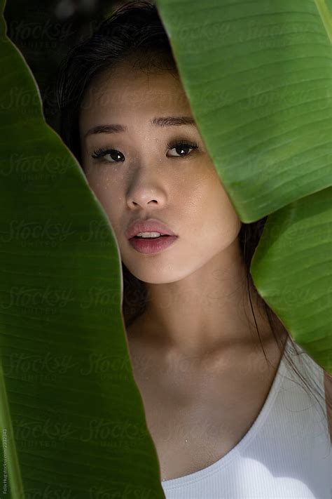 A Head And Shoulder Beauty Portraiture Of A Young Asian Woman Half