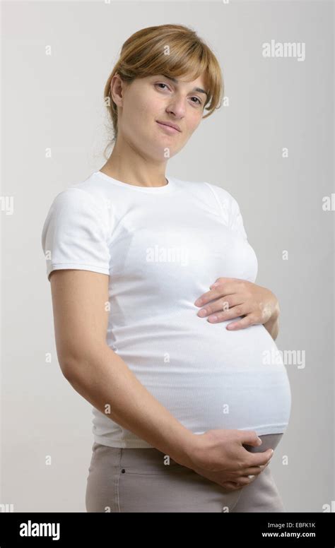 Pregnant Woman Holding Her Hands On Her Stomach Stock Photo Alamy