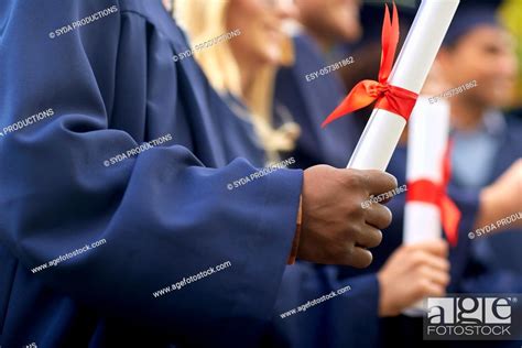 Graduate Students In Mortar Boards With Diplomas Stock Photo Picture