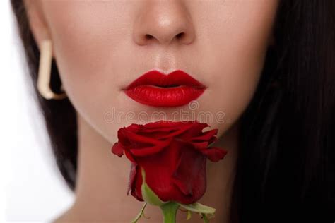 Female Lips With Bright Red Makeup And Red Rose Flower Stock Image