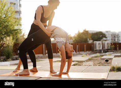 Two Young Girls Practicing Stretching And Yoga Workout Exercise