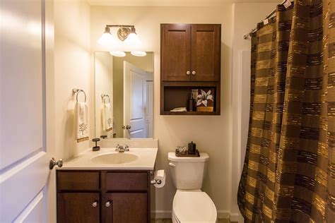 The mirrored windowpanes on these doors are decorative wall art when closed, and are designed to conceal a tv screen when it s not in use. Linen cabinet makes a great storage solution for down ...