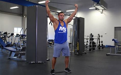 Banded Standing Shoulder Press Video Exercise Guide And Tips