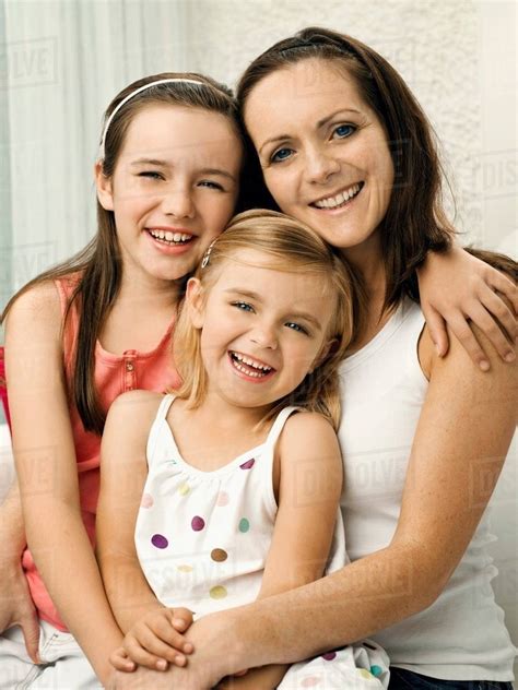 A Portrait Of A Mother And Two Daughters Stock Photo Dissolve