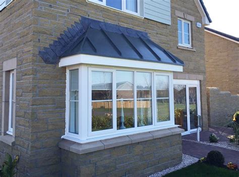 Bay windows are a quick and easy way of transforming a flat window in to a more attractive and door canopies can be a superb solution to add value to any home by improving its appearance. GRP Bay Windows | Peter C Cook Ltd. GRP Joinery Technology