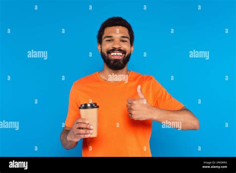 Happy African American Man Showing Thumb Up And Holding Paper Cup