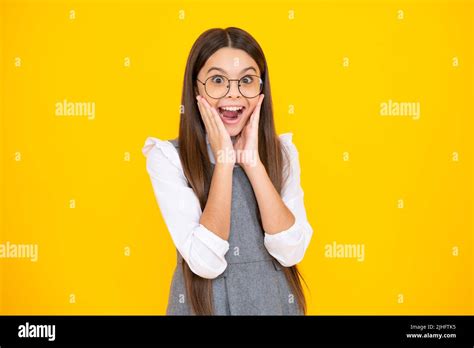 Shocked Teenager Child Girl Portrait Isolated On Yellow Background