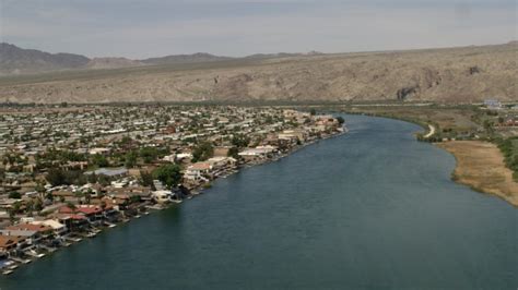 Follow The Colorado River Past A Small Riverfront Hotel In Bullhead