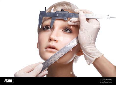 beauty blonde woman with measuring devices near face isolated on white