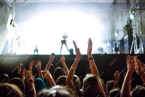 Premium Photo Srowd With Raised Hands At Music Festival Fans Enjoying